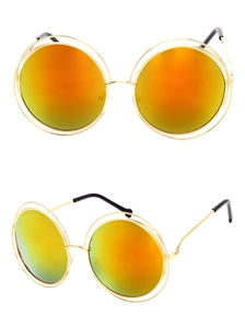 Detail of round gold metal sunglasses with orange and yellow gradient mirrored lenses