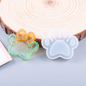 Detail of a cat paw silicone mold showing the gradient resin casting with glitter