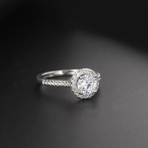 Macro view of halo setting ring with round brilliant cut cubic zirconia and pavé band