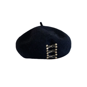 Classic black wool beret with stylish metal button accents for vintage fashion look