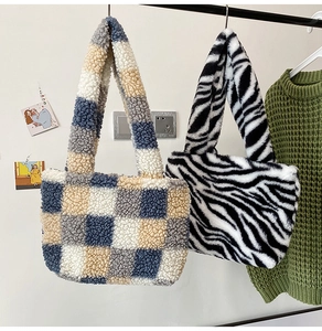 Detail of plush checkerboard and zebra pattern tote bags for autumn winter seasons