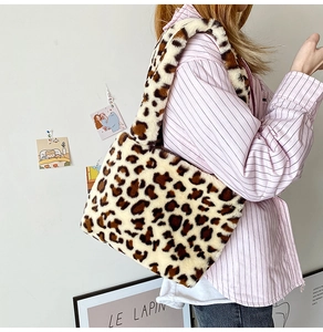 Detail of leopard print plush tote bag showing the soft texture and large shoulder capacity