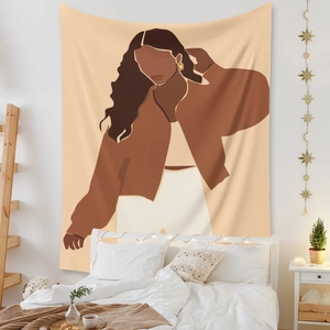 Detail showing an abstract portrait tapestry hanging over a bed with warm star lights