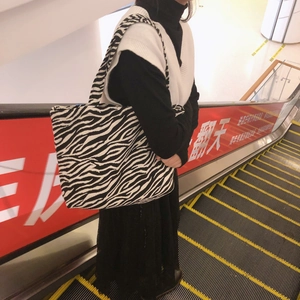 Detail of zebra print canvas tote bag with large capacity and thick shoulder straps