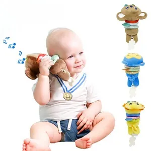 Detail of infant stroller plush musical toys featuring dog monkey and lion designs