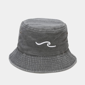 Close-up of vintage washed grey bucket hat with detailed white wave embroidery