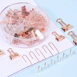 Set cancelleria ufficio oro rosa con clip e puntine in una scatola circolare