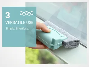 Detail view of a handheld cleaning brush with scouring pads for window groove tracks
