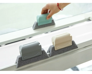 Action shot of the gap cleaning brush removing dust from a window groove track