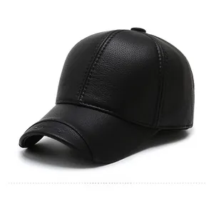 Detail of black leather baseball cap featuring lychee texture and Sport embossed brim
