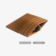 Detail of brown woven leather wallet showing multiple card slots and change pocket
