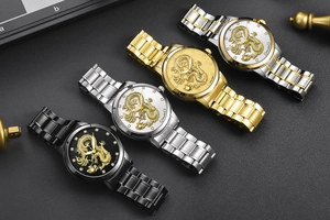 Detail of luxury dragon embossed quartz watches with crystal markers and steel bands