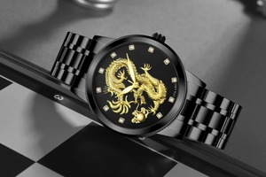 Detail of men's quartz watch featuring golden dragon relief and diamond hour markers