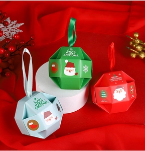 Three-color polyhedron Christmas gift boxes with ribbons on red silk background