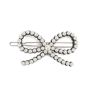 Elegant pearl bow hair clip with white pearls and silver metal spring fastener