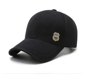 Detail of HEYHAT SPORTS embroidery and shield patch on black cotton baseball cap