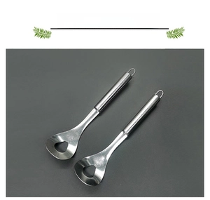 Close-up of polished stainless steel meatball maker with triangular drainage hole and long handle