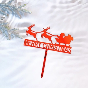 Red acrylic Merry Christmas cake topper with Santa Claus and reindeer on white fabric