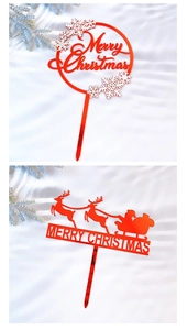 Detail of red acrylic Merry Christmas cake toppers with snowflake and reindeer patterns