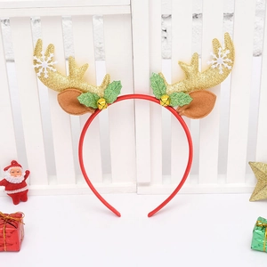 Detailed view of Christmas headband with golden glitter antlers and festive bells
