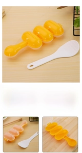 Three-hole sushi ball mold set with rice paddle on wooden background detail