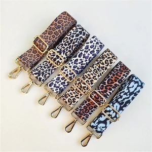 Detailed view of six leopard print replacement straps with adjustable gold hardware