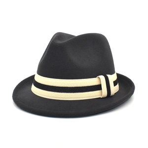 Detail of black fedora wool hat showing the striped ribbon band and textured felt finish