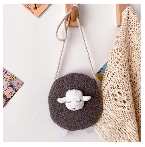 Plush lamb cartoon shoulder bag for kids in dark grey hanging on a wooden hook