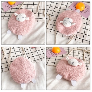Detail of pink fleece plush sheep crossbody bag with white shoulder strap and 3D ears