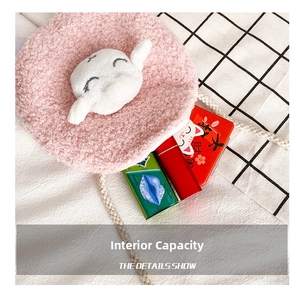 Detail showing the inner capacity of a pink plush Cinnamoroll coin purse with soft texture