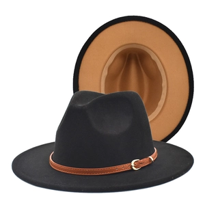 Detail of two-tone wool fedora featuring black exterior, camel interior and leather strap
