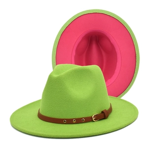 Detail of two-tone wool fedora with green exterior and pink lining plus leather strap