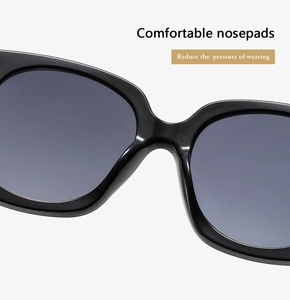 Detail of comfortable integrated nose pads on black oversized sunglasses for pressure relief