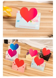 Close-up and variety showcase of 3D heart-shaped greeting cards on a wooden surface