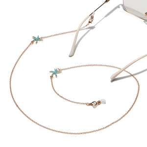 Golden eyewear chain with turquoise starfish charms and anti-slip silicone loops for summer style
