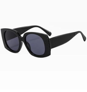 Close-up of the detailed diamond pattern texture on the black sunglasses temples