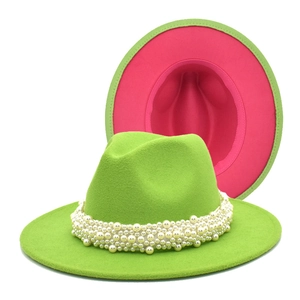 Detail of neon green wool fedora featuring luxury pearl band and pink contrast lining