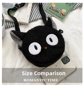 Detail of round black plush cat crossbody bag with adjustable strap and cute embroidery