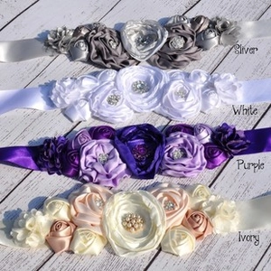 Detailed comparison of satin flower sashes with rhinestones and pearls in four colors
