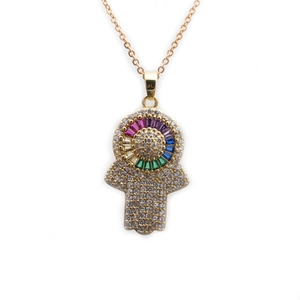 Detailed close-up of golden Hamsa Hand pendant with colorful cubic zirconia stones