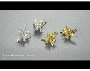 Macro shot of 925 sterling silver iris flower stud earrings in gold and silver finishes