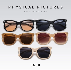 Multiple pairs of retro thick frame sunglasses with colorful lenses and silver stud detail