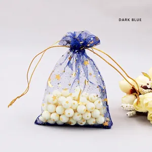 Dark blue organza jewelry pouch with gold star moon pattern and drawstring closure
