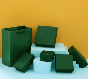 Dark green jewelry box set with textured finish and matching paper gift bag