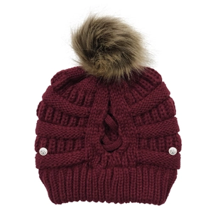 Women's wine red knit beanie with faux fur pompom and cross-stitch pattern