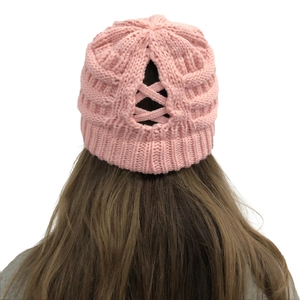Detail view of pink knit beanie with back crisscross design for ponytails