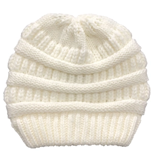 Close-up of white chunky knit texture on a winter beanie for women