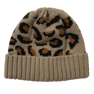 Close-up of leopard print knit beanie with khaki ribbing and thick texture detail