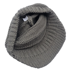 Detail view of dark gray winter knit hat interior with fabric composition care label