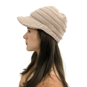 Detailed close-up showing the warm beige knitted texture of this winter thermal peak hat